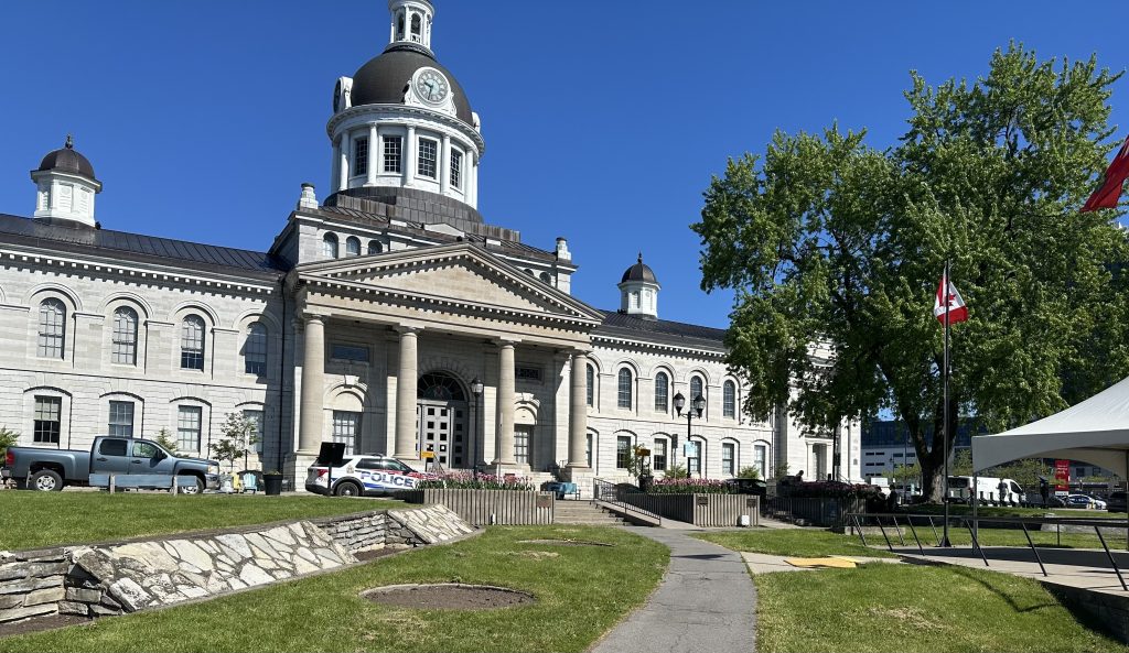 picture of Kingston City Hall. Bright, blue skies and the building can be seen at the back